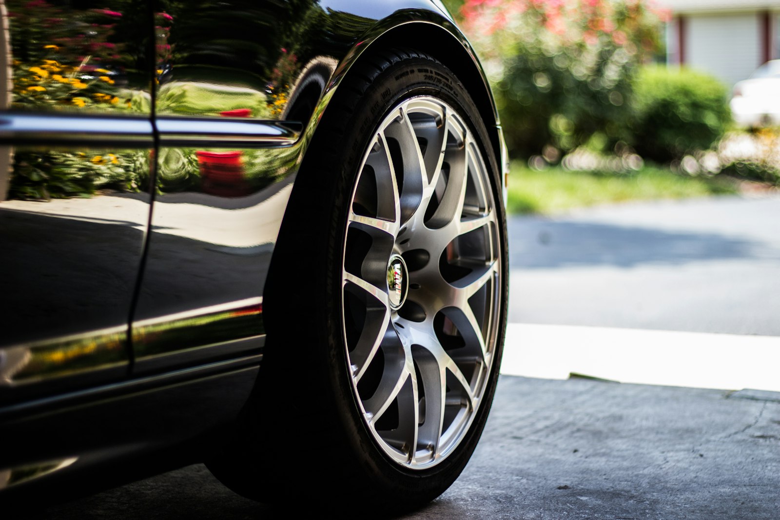 Polished alloy wheel on a black car